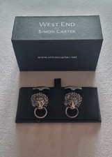 Lion head cufflinks by Simon