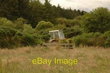 Photo 6x4 Abandoned tractor Whitecairns/NJ9217 An old JCB in a field. It c2007