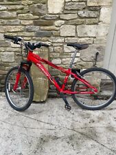 Red specialized childs bike 20 inch wheel .