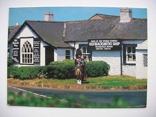 Gretna Green - Famous Old Blacksmith's Shop. Innes and Cromb - bagpipes - piper.
