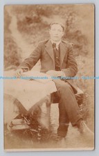 R807676 Man Sitting at the