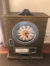 Vintage Bryans 12-win penny arcade clock machine