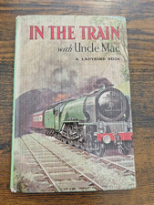 VINTAGE LADYBIRD  IN THE TRAIN