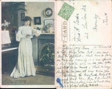 Woman reading in Victorian interior 1908 postmark