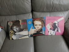 simply red vinyl lp,s=3.see photos...signs of being played..