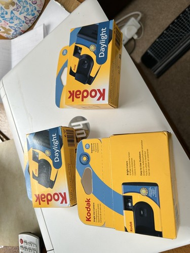 Three disposable cameras - cameras,