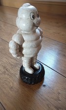 Original cast iron Michelin man approximately 10 inches high 