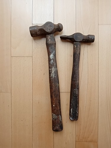 Two antique hammers cross - two, hammers.