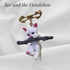 Cute Cat / Kitten Hanging on a