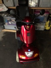TGA Road Scooter RED GOOD CONDITION WEAR AND TEAR SCRATCHES.TWO NEW BATTERIES 