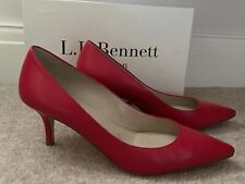 LK Bennett Florida closed toe raspberry kid leather shoes with matching clutch.