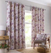 Eyelet curtains lined window