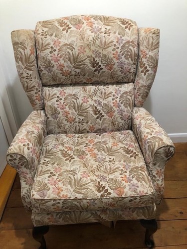 Upholstered wing back armchair