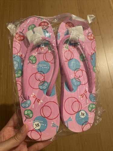 Pink flip flops with japanese - with,