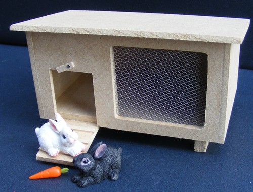 Wooden hutch with rabbits - wooden,