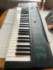 Yamaha PSR-6 Keyboard with stand, adapter and Beginners Manual.