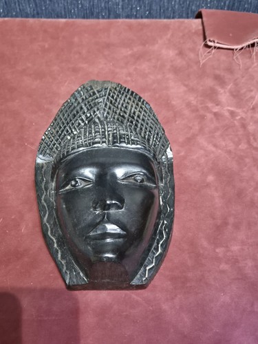 Hand carved african face - hand,
