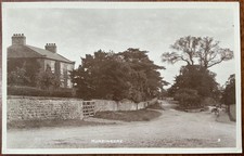 RPPC VIEW ALONG STREET HUNSINGORE VILLAGE NEAR WETHERBY NORTH YORKSHIRE BRAMLEY