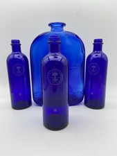 4 Cobalt Blue Cevorative Bottles 3 Neals Yard and One Larger Decorated unbranded