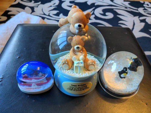 Three snow globes - three,