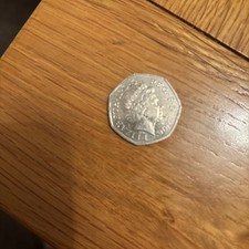 This is a listing for a circulated 50 pence piece, 2006. VC on rear of the coin