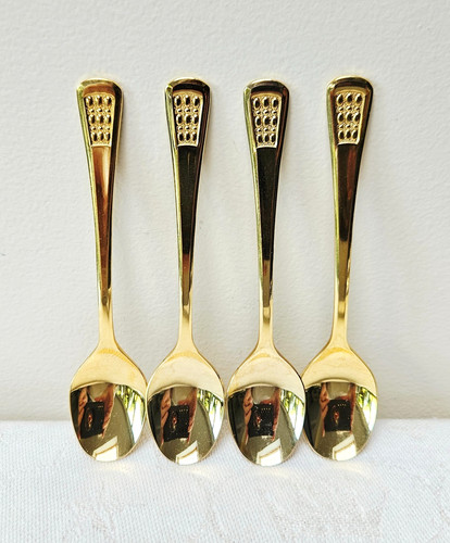 Gold coloured coffee - , spoons