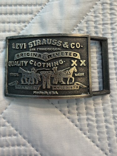 Levi gold tone embossed - tone,