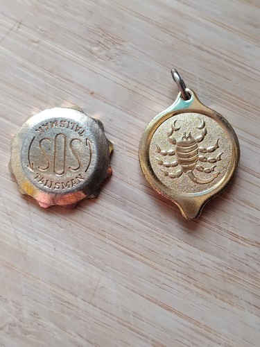 Sos talisman gold tone pendant - sos,