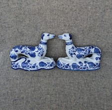 Pair of vintage 13.5 cm blue and white greyhound type dog figurines on bases.