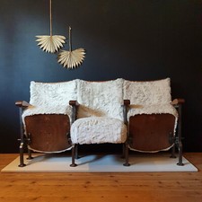 Refurbished vintage cinema seats in white faux fur fabric, three seater version