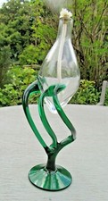 Clear Glass Oil Lamp Light on green glass stand