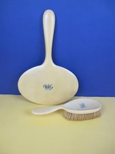 Vintage hand held mirror and hair brush set. 