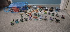 Skylander bundle  30 figures.  Giants, gyros  some rare comes with bag. see pics