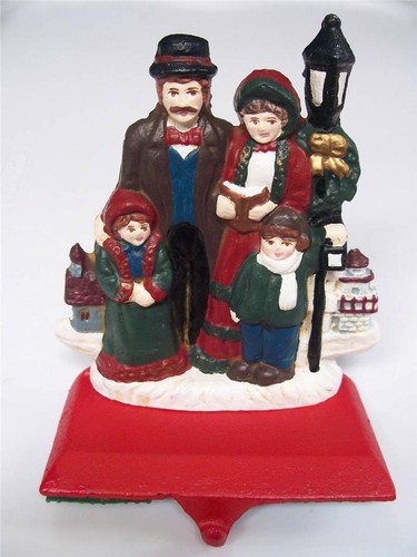 Carolers singing lamp post - carolers,