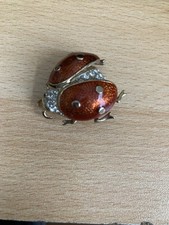 UNUSUAL STONE SET ENAMELED