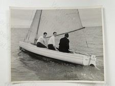3 Men Sailing Small Boat