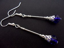 A PAIR OF DANGLY COBALT ROYAL BLUE  CRYSTAL SILVER PLATED EARRINGS.