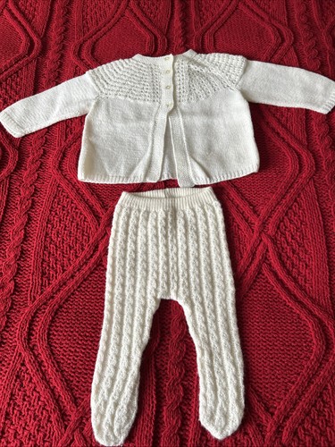 Hand knitted white baby - hand,
