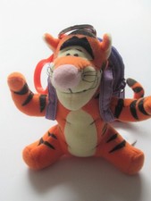 Tigger soft toy with purple rucksack on bag, attached