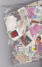 Worldwide - 62g packet of mint & used stamps off paper