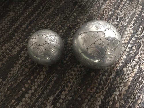 Two decorative metal balls one - two,