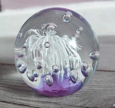 glass paperweight, white flower or sea anemone, bubbles on a purple base