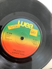 The Scratch.   Surface Noise.   7” vinyl  1980. WEA