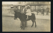 COLWYN BAY PIER Lady with Child on Donkey. RPPC Real photo postcard c.1910