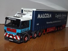 CORGI MODERN TRUCKS - MAN  WITH CURTAINSIDE - W H MALCOLM