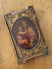 A vintage Italian Florentine book shaped box depicting the Madonna & Child