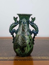 C.H. Brannam Barum pottery dragon handled vase, in green with fish motifs, 1908