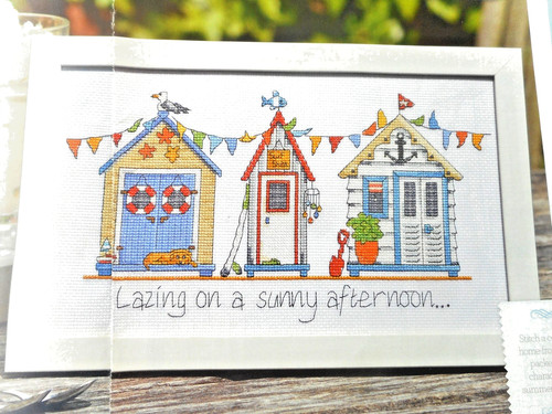 Row colourful beach huts - row,