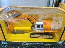 Caramara Excavator With Pecker Attachment.