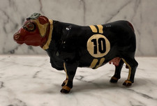 Painted Racing Cow Figurine